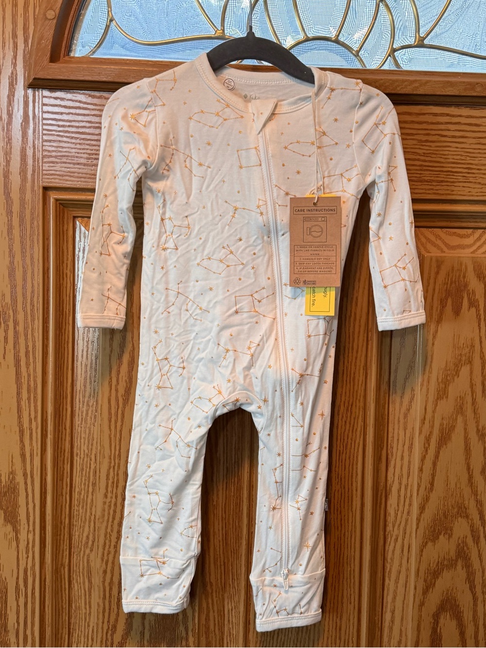 Kyte BABY Cream Footed One-Piece with Orange Star Motif